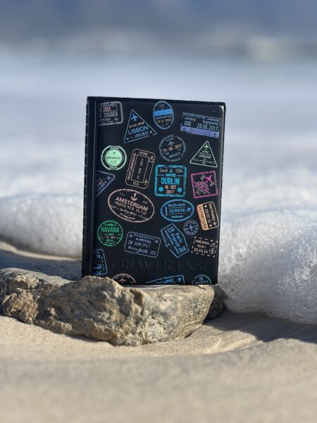 Durable Explorer edition Crew License book, perfect for organizing pilot and flight attendant credentials, showcasing a global career with unique passport stamps.